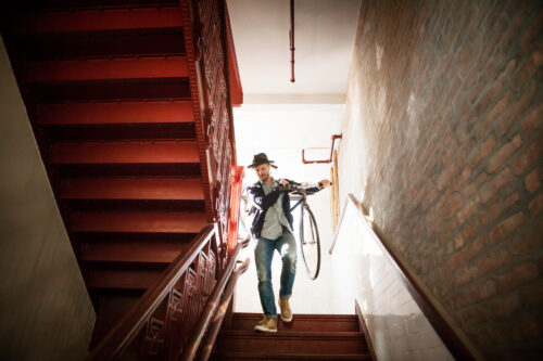 premises liability case man walking down stairs with bike