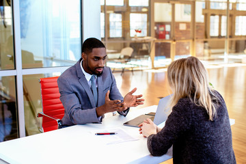 lawyer and woman sitting at table