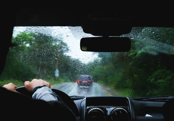 person driving in rain