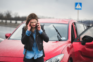 woman on the phone after car accident