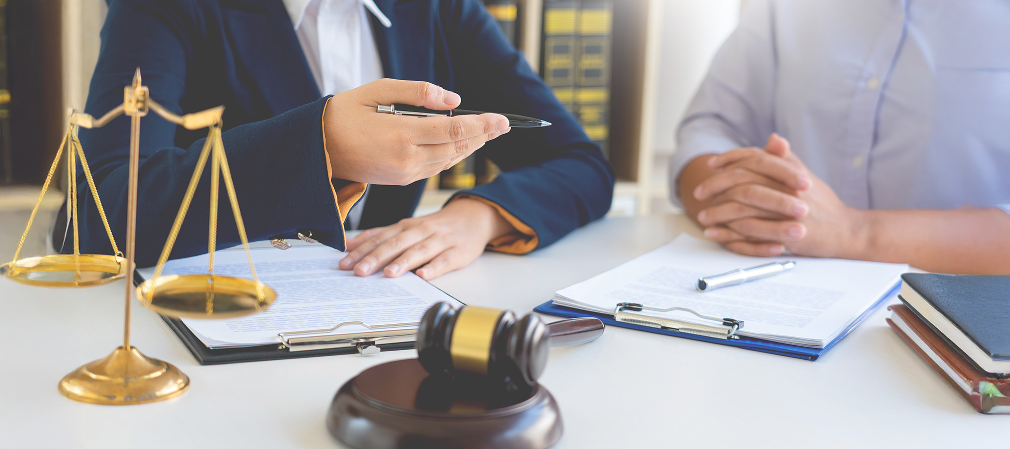 Female Lawyer explaining legal situation and discussing with contract papers